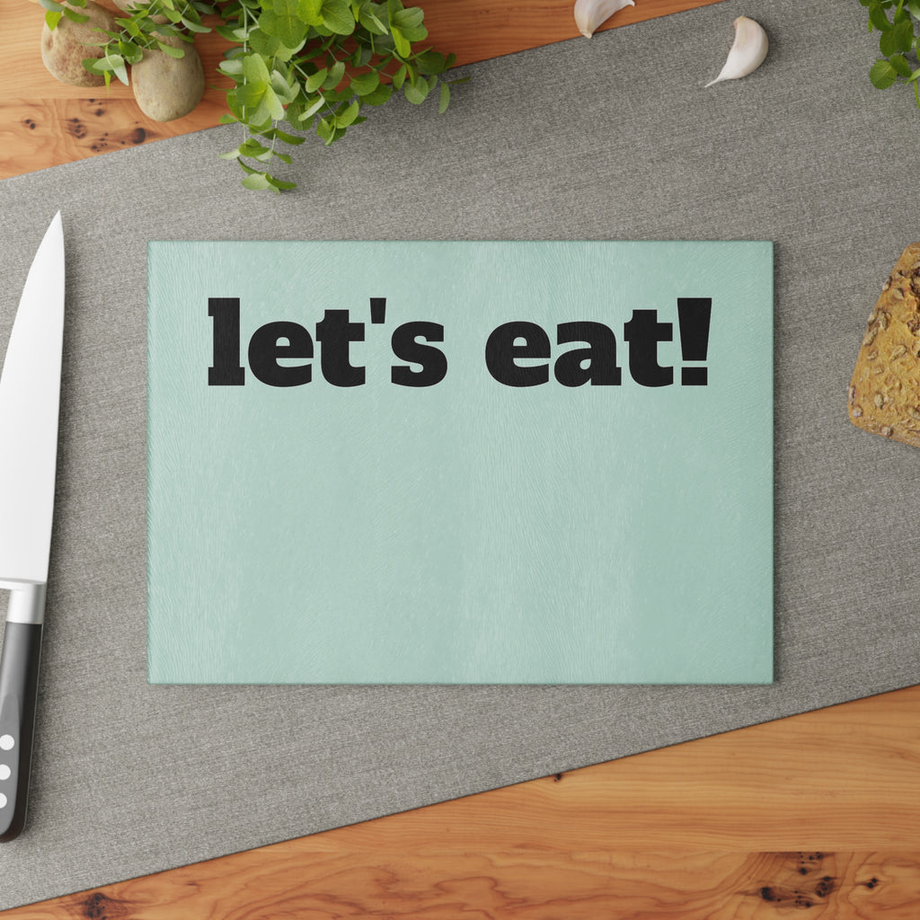 let's eat! Glass Cutting Board | Mint background, Bold black text