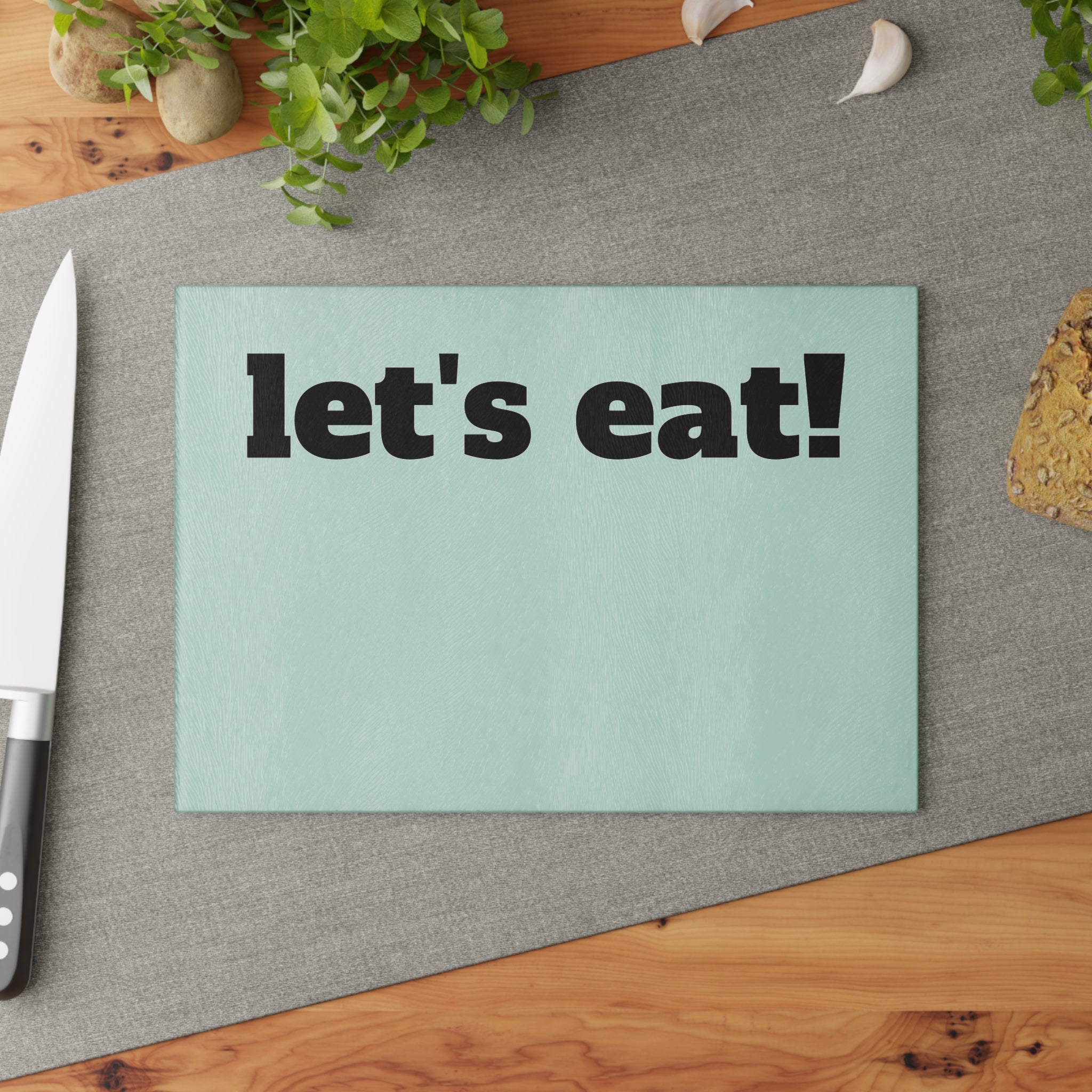 let's eat! Glass Cutting Board | Mint background, Bold black text